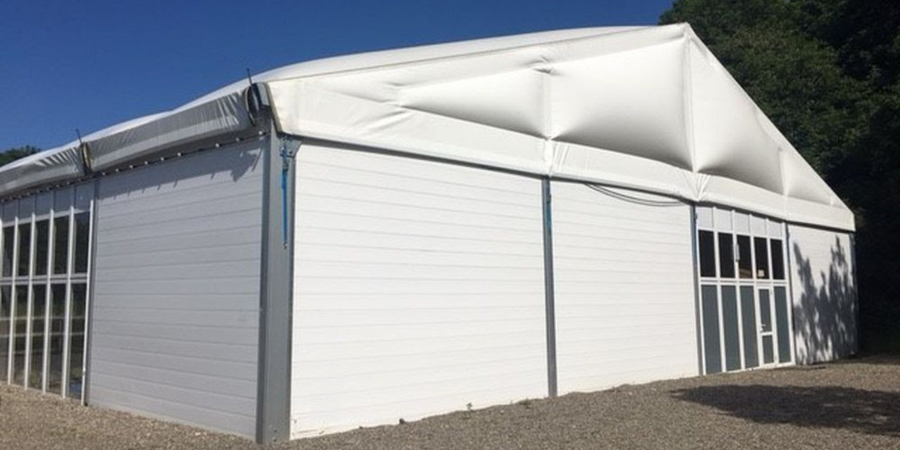 Marquee with solid walls, windows and an insulated roof